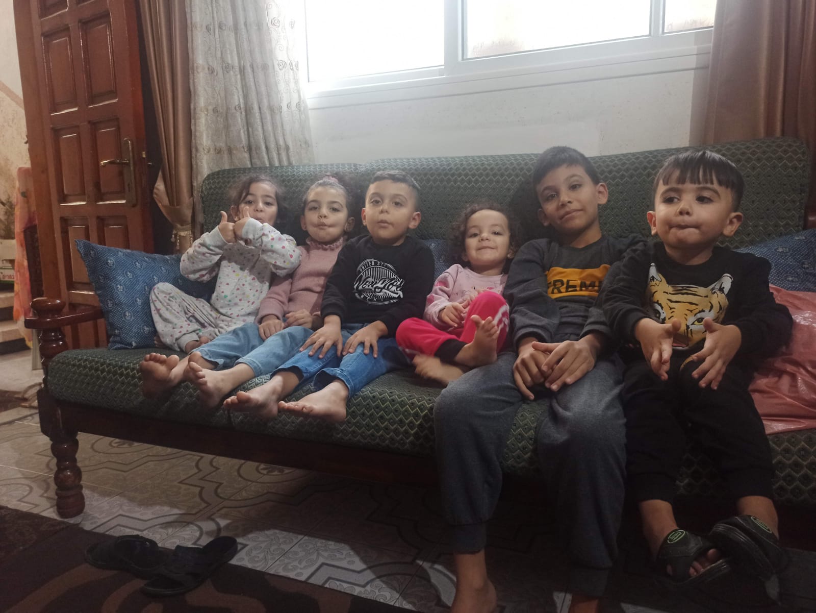 納斯曼家的孩子，照片上的其中5人已在攻擊中被殺害。©Private